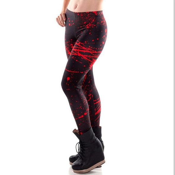 Model wearing black leggings with red blood spatter pattern