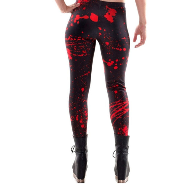 Waist down photo of model wearing black leggings with red splatter pattern, from the rear
