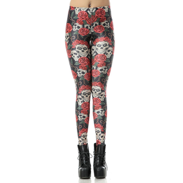 Front view of model wearing leggings with scary skulls and roses printed on it
