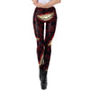 Front view of model wearing red and black leggings with pattern of evil smile and "haha" blood red lettering printed on them