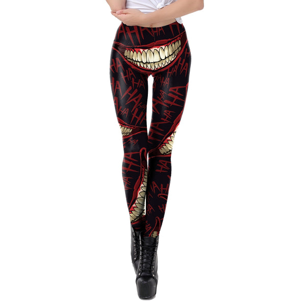Front view of model wearing red and black leggings with pattern of evil smile and "haha" blood red lettering printed on them